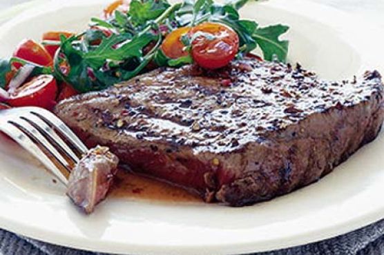Coriander steaks with tomato & rocket salad