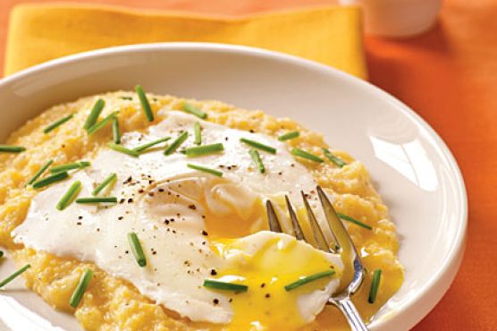 Eggs Blindfolded over Garlic-Cheddar Grits