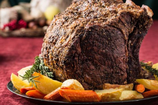 Herb-Crusted Beef Rib Roast with Potatoes, Carrots, and Pinot Noir Jus
