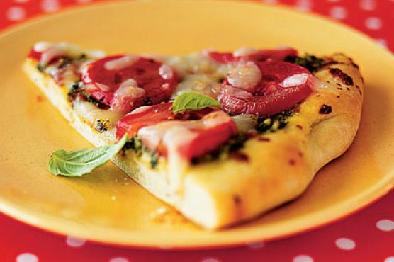 Pesto Pizza With Sliced Tomatoes