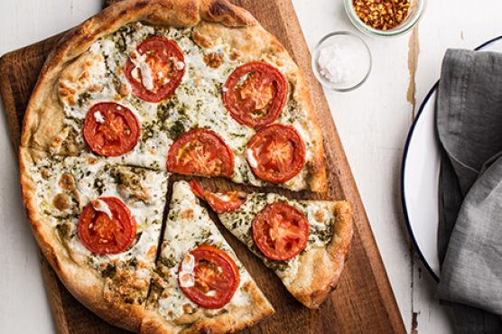 Pizza with Pesto, Fresh Tomatoes, and Mozzarella