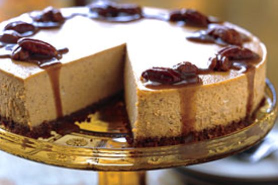 Spiced Pumpkin Cheesecake with Caramel-Bourbon Sauce