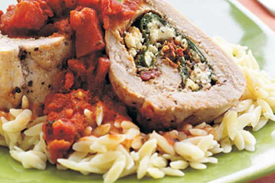 Spinach, Pesto, and Feta-Stuffed Pork Tenderloin with Chunky Tomato Sauce