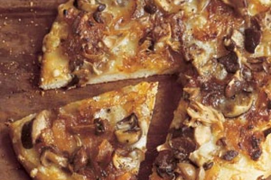 Wild Mushroom Pizza with Caramelized Onions, Fontina, and Rosemary